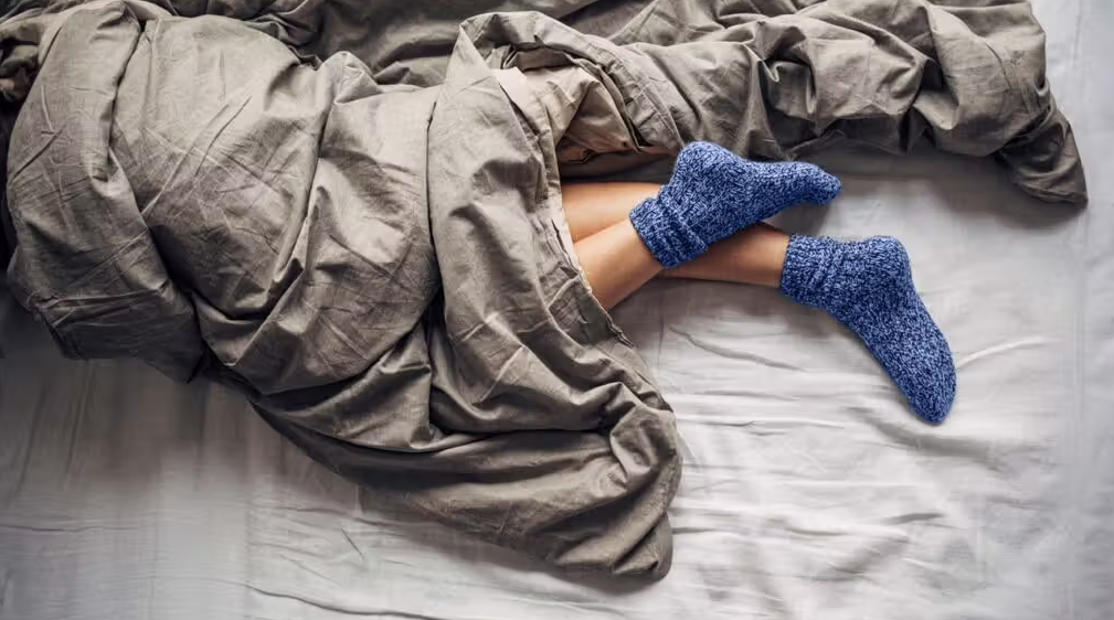 Sleeping In Sweaters And Socks: Comfort Or Risk?