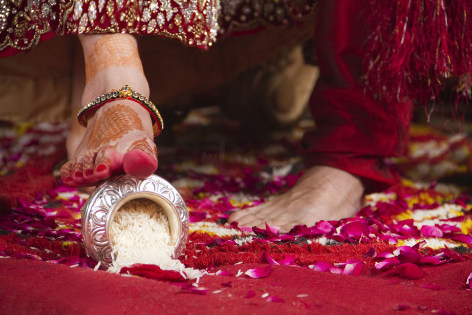 Why Do Newly Wed Brides Kick A Pot Of Rice With Their Feet During Grihapravesh
